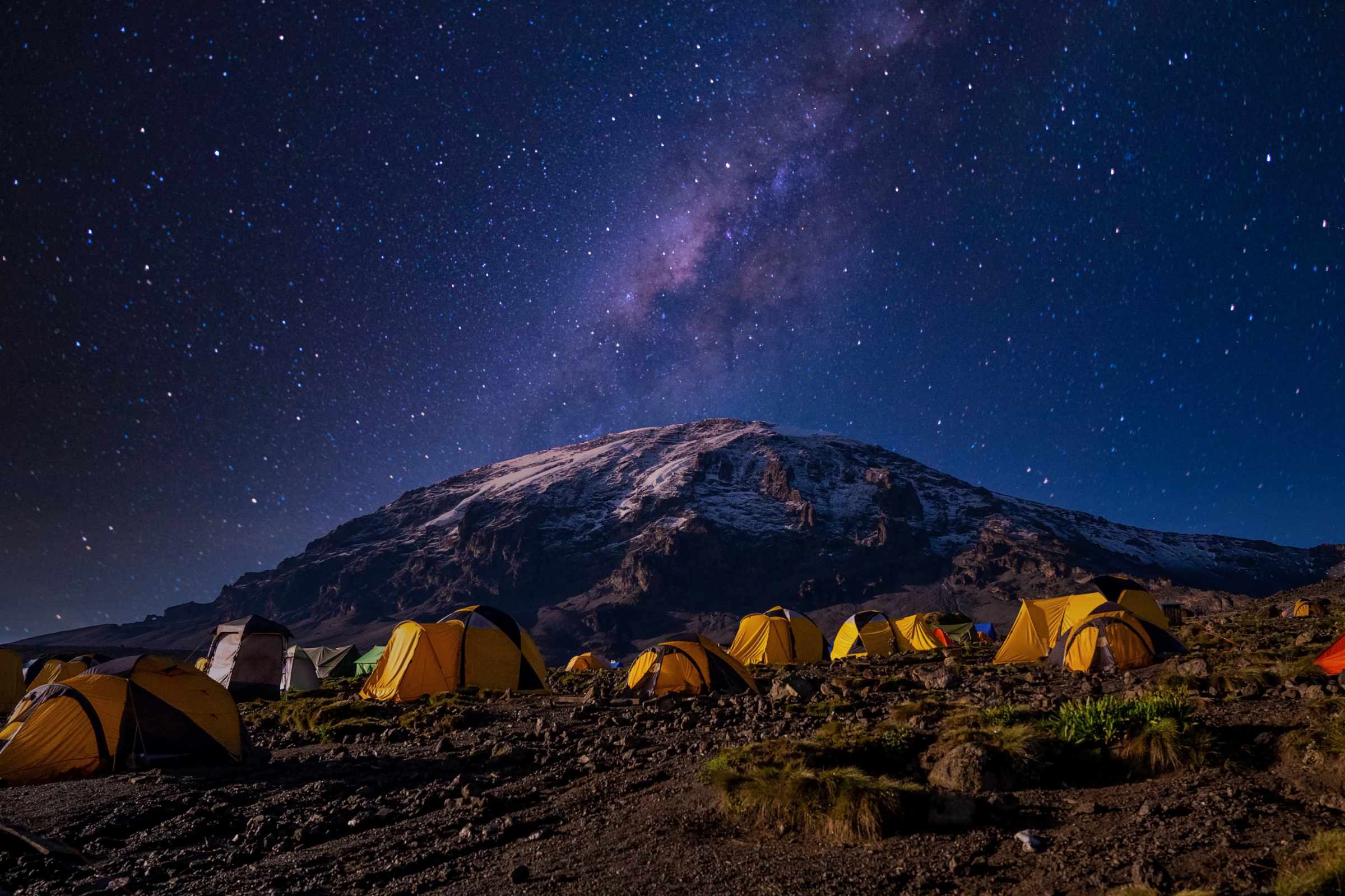 base camp with many tents watching stars